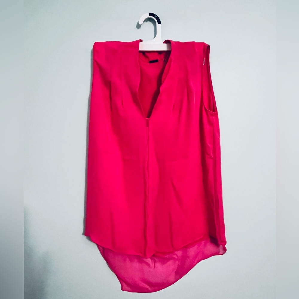 Soft, light, shirt in a bright type of pink that will definitely catch attention
